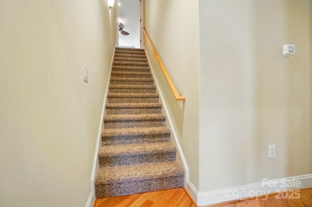129 Daniel Efird Dr, Mount Holly, NC 28120 - staircase with wood finished floors and baseboards