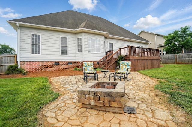 129 Daniel Efird Dr, Mount Holly, NC 28120 - rear view of property with a patio area, a fire pit, crawl space, and a deck