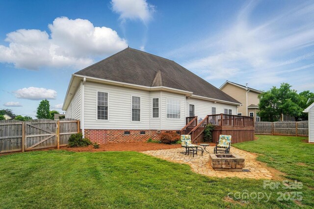 129 Daniel Efird Dr, Mount Holly, NC 28120 - rear view of house featuring a fire pit, a patio area, a deck, roof with shingles, and crawl space