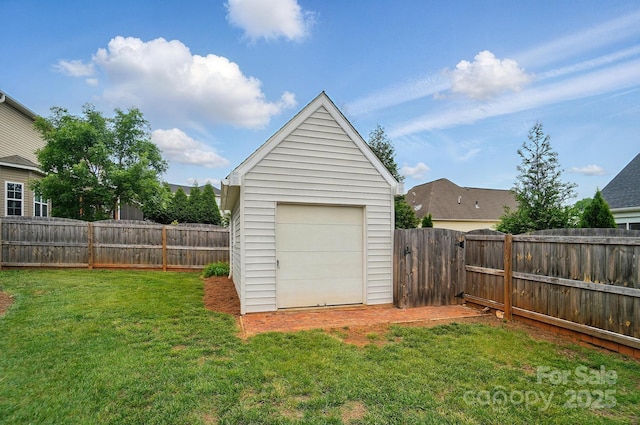 129 Daniel Efird Dr, Mount Holly, NC 28120 - garage featuring a storage unit