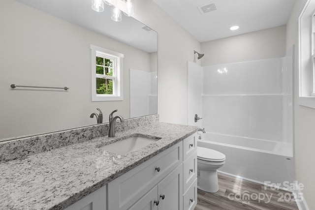 894 Oval St, Kannapolis, NC 28081 - full bathroom featuring toilet, wood finished floors, bathing tub / shower combination, and vanity