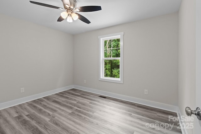 894 Oval St, Kannapolis, NC 28081 - spare room featuring wood finished floors, a ceiling fan, and baseboards