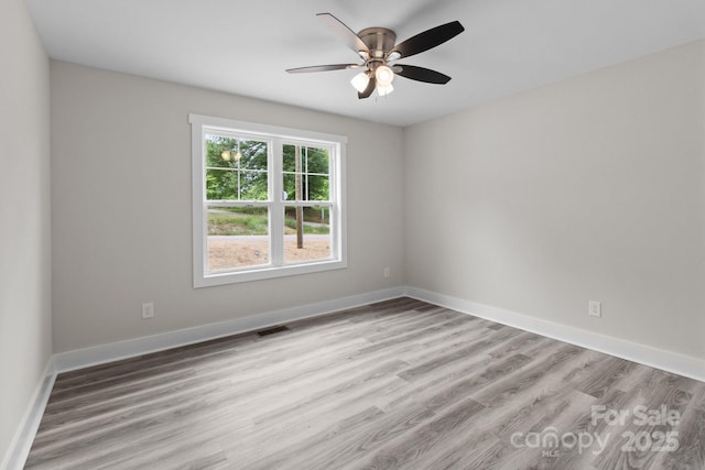 894 Oval St, Kannapolis, NC 28081 - empty room with ceiling fan, light wood-style flooring, and baseboards