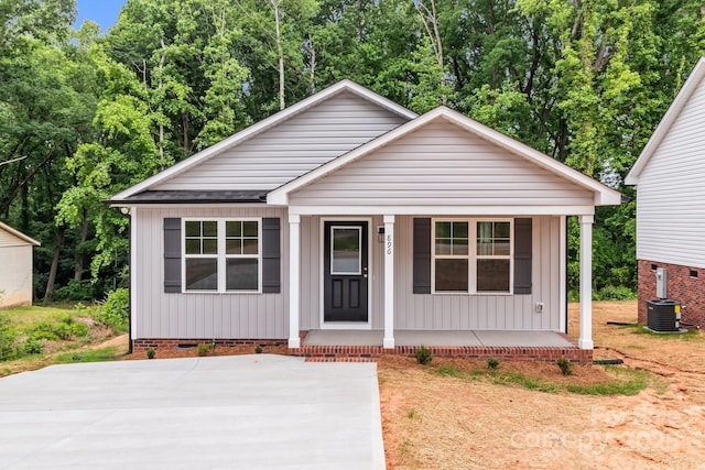 896 Oval St, Kannapolis, NC 28081 - bungalow-style home with a porch, crawl space, and central AC unit