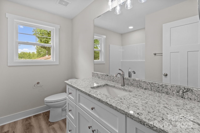 896 Oval St, Kannapolis, NC 28081 - bathroom featuring baseboards, wood finished floors, toilet, vanity, and a shower