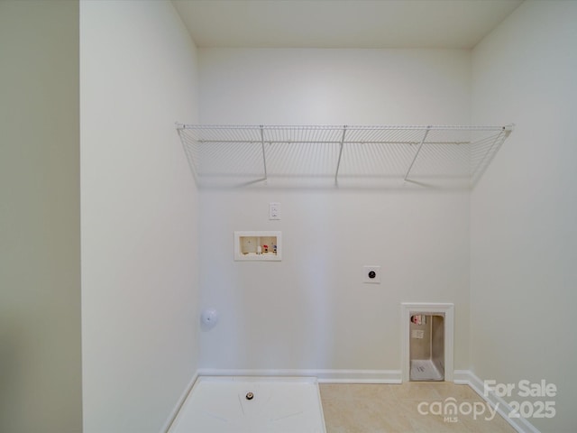laundry area featuring hookup for a washing machine, electric dryer hookup, baseboards, gas dryer hookup, and light tile patterned floors