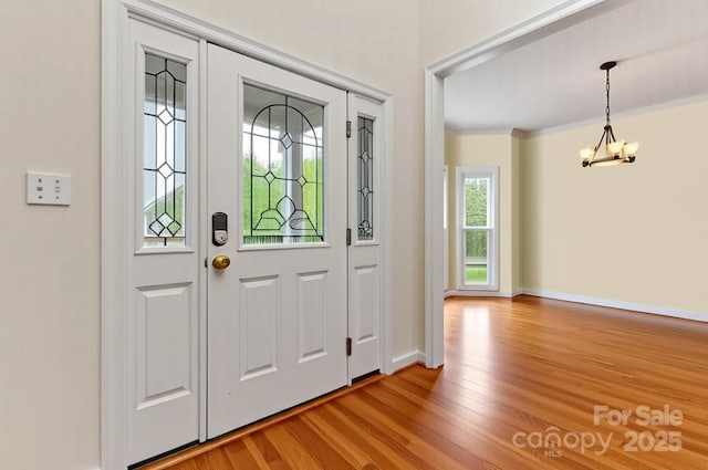 4619 Glasgow Ct, Gastonia, NC 28056 - entrance foyer with light wood-style floors and a chandelier
