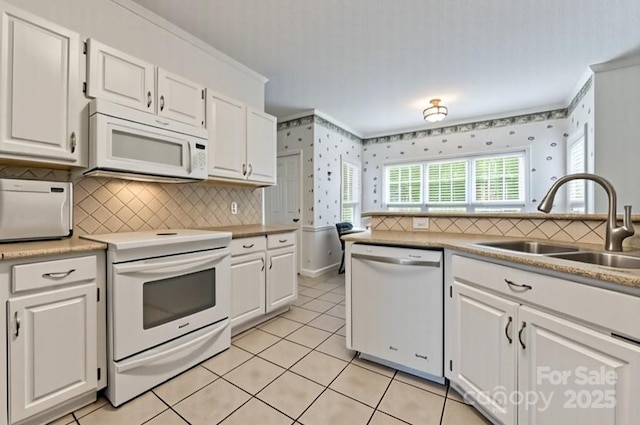 4619 Glasgow Ct, Gastonia, NC 28056 - kitchen with white appliances, ornamental molding, white cabinets, decorative backsplash, and light tile patterned floors