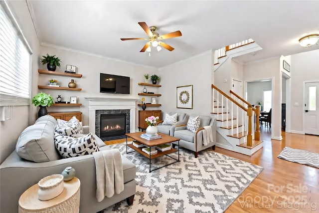 4619 Glasgow Ct, Gastonia, NC 28056 - living room featuring plenty of natural light, a ceiling fan, wood finished floors, and stairs
