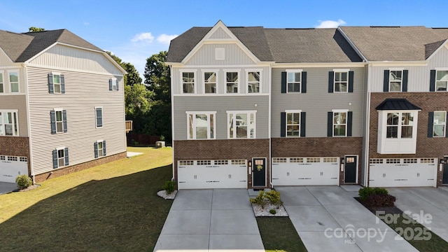 2665 Grantham Place Dr, Fort Mill, SC 29715 - view of front of property featuring concrete driveway, board and batten siding, an attached garage, and a front yard