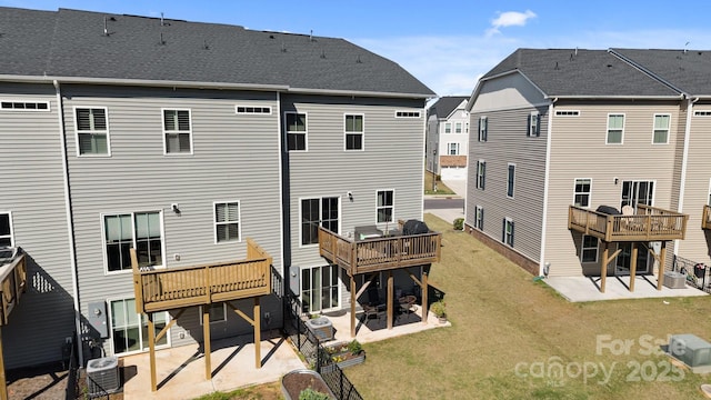 2665 Grantham Place Dr, Fort Mill, SC 29715 - rear view of house with a patio area, a wooden deck, and a yard