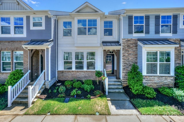 110 Synandra Dr Unit B, Mooresville, NC 28117 - townhome / multi-family property with stone siding, a standing seam roof, metal roof, and board and batten siding