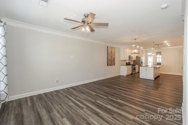 110 Synandra Dr Unit B, Mooresville, NC 28117 - unfurnished living room with a sink, crown molding, dark wood-style flooring, a ceiling fan, and baseboards