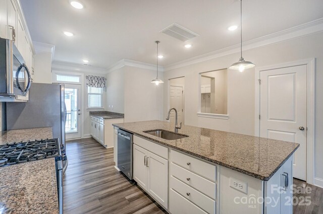 110 Synandra Dr Unit B, Mooresville, NC 28117 - kitchen with appliances with stainless steel finishes, a sink, white cabinetry, crown molding, and dark wood-type flooring