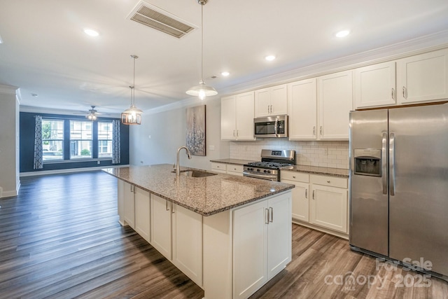 110 Synandra Dr Unit B, Mooresville, NC 28117 - kitchen featuring stainless steel appliances, a sink, crown molding, dark wood-style flooring, and decorative backsplash