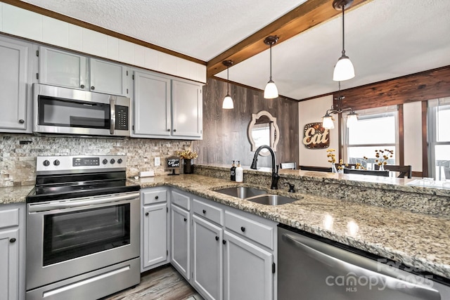 301 Pinnacle Inn Rd Unit 2210, Beech Mountain, NC 28604 - kitchen featuring stainless steel appliances, a sink, ornamental molding, a textured ceiling, and tasteful backsplash