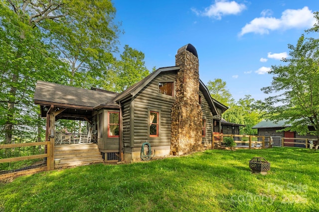 214 Hubert Mccall Rd, Balsam Grove, NC 28708 - view of side of home with an outdoor fire pit and a chimney