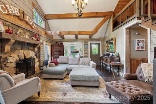 214 Hubert Mccall Rd, Balsam Grove, NC 28708 - living room with wood finished floors, high vaulted ceiling, beamed ceiling, a fireplace, and a chandelier