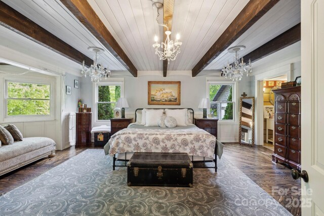 214 Hubert Mccall Rd, Balsam Grove, NC 28708 - bedroom featuring a chandelier, wood finished floors, and beamed ceiling