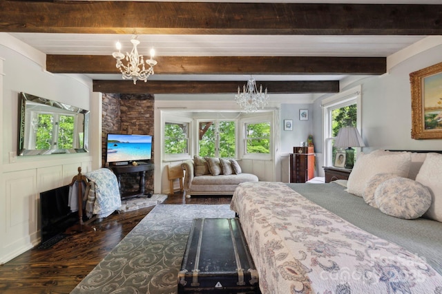 214 Hubert Mccall Rd, Balsam Grove, NC 28708 - bedroom with a chandelier, wood finished floors, and beam ceiling