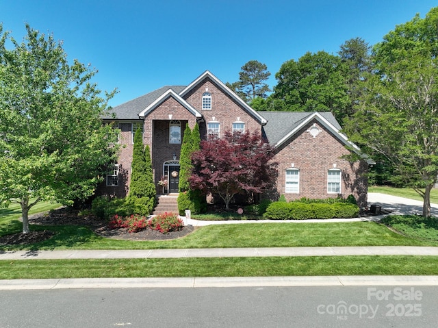 201 Vanderbilt Blvd, Locust, NC 28097 - view of front of property with brick siding and a front lawn