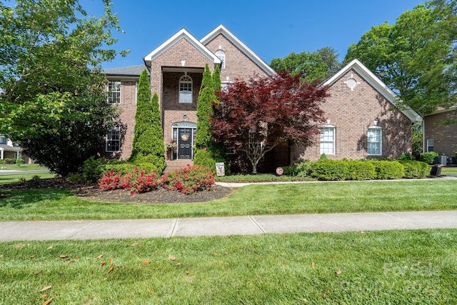 201 Vanderbilt Blvd, Locust, NC 28097 - view of front of home with brick siding and a front yard