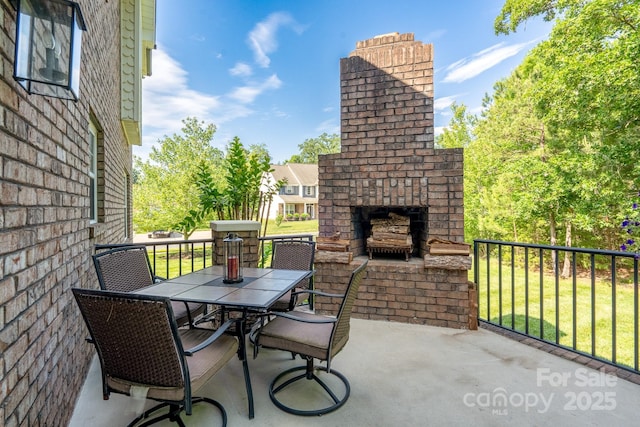 201 Vanderbilt Blvd, Locust, NC 28097 - view of patio featuring an outdoor brick fireplace and outdoor dining area