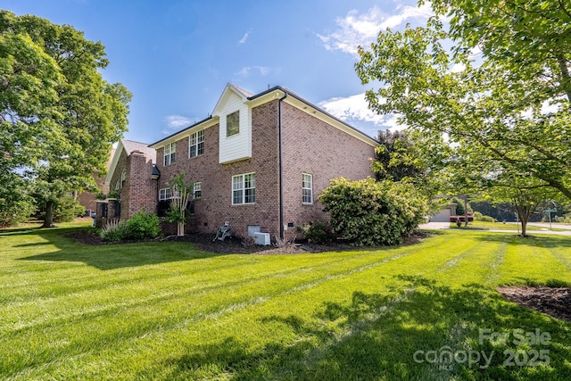 201 Vanderbilt Blvd, Locust, NC 28097 - view of side of property featuring crawl space, a lawn, and brick siding