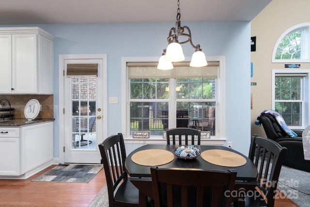 201 Vanderbilt Blvd, Locust, NC 28097 - dining area with wood finished floors and a chandelier
