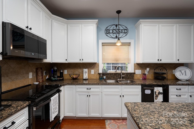 201 Vanderbilt Blvd, Locust, NC 28097 - kitchen with black appliances, a sink, and white cabinets