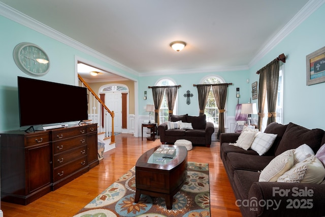 201 Vanderbilt Blvd, Locust, NC 28097 - living room with stairs, ornamental molding, wainscoting, and light wood-style flooring