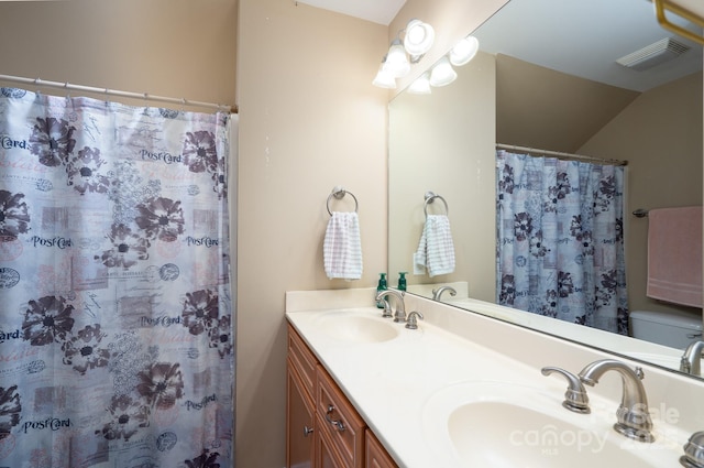 201 Vanderbilt Blvd, Locust, NC 28097 - bathroom with double vanity, lofted ceiling, and a shower with curtain