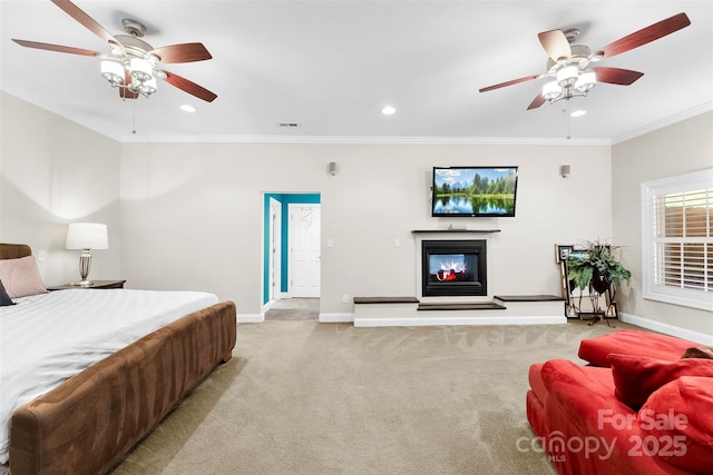 5418 Commodore Pl, Clover, SC 29710 - bedroom with carpet flooring, baseboards, a glass covered fireplace, crown molding, and recessed lighting