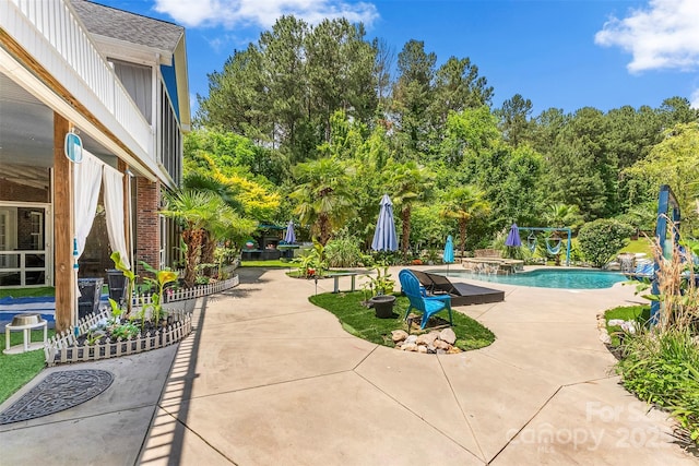 5418 Commodore Pl, Clover, SC 29710 - swimming pool featuring a patio and view of wooded area