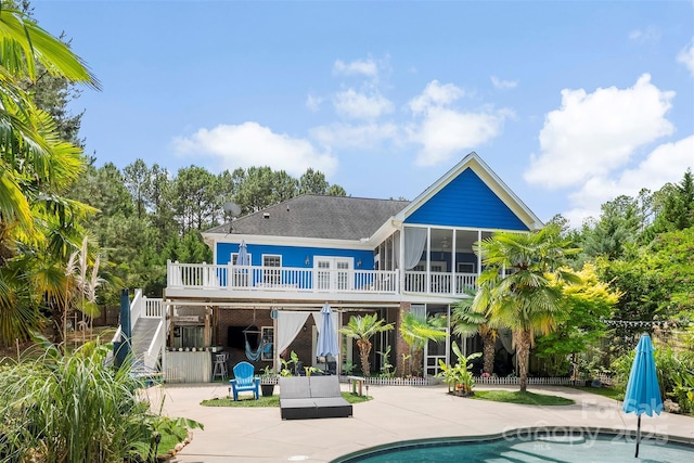 5418 Commodore Pl, Clover, SC 29710 - back of property with stairs, a patio, a wooden deck, an outdoor pool, and a sunroom