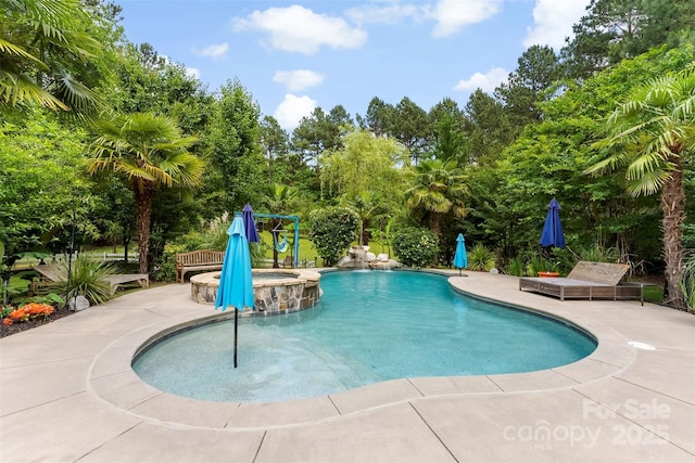 5418 Commodore Pl, Clover, SC 29710 - view of pool with a patio area, view of wooded area, and a pool with connected hot tub