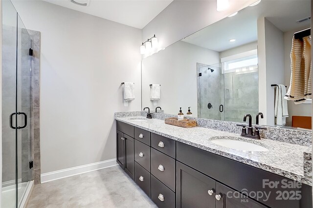 4116 Spring Cove Way, Belmont, NC 28012 - bathroom featuring a stall shower, baseboards, and double vanity
