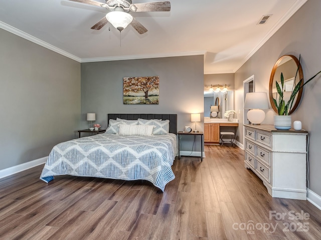 bedroom with wood finished floors, baseboards, ornamental molding, and ceiling fan