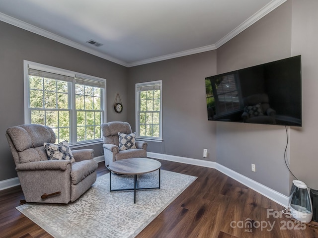 living area with baseboards, dark wood-type flooring, and ornamental molding
