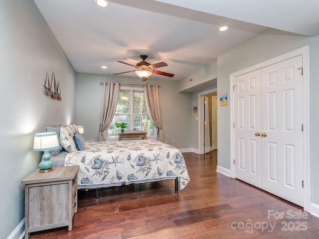 bedroom featuring baseboards, wood finished floors, recessed lighting, a closet, and a ceiling fan