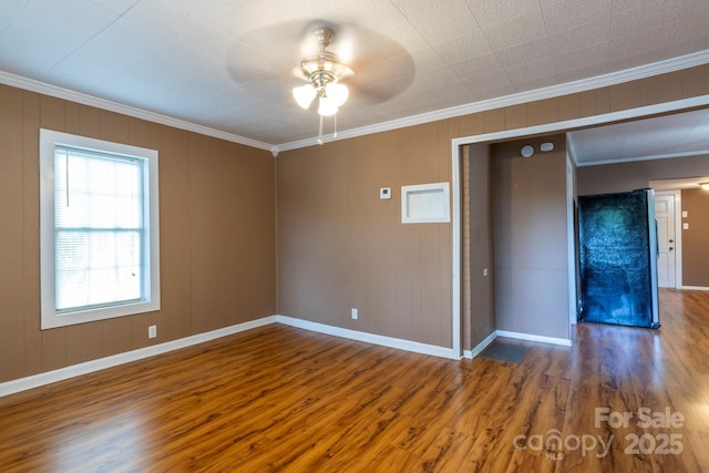 205 Stowe Acres Rd, Kings Mountain, NC 28086 - spare room with crown molding, wood finished floors, ceiling fan, and baseboards