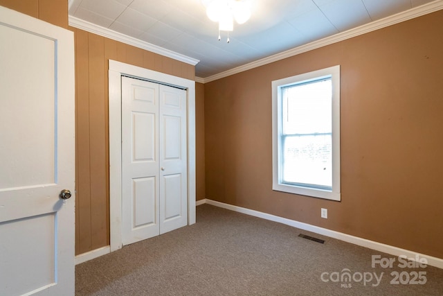 205 Stowe Acres Rd, Kings Mountain, NC 28086 - unfurnished bedroom featuring crown molding, a closet, carpet floors, and baseboards