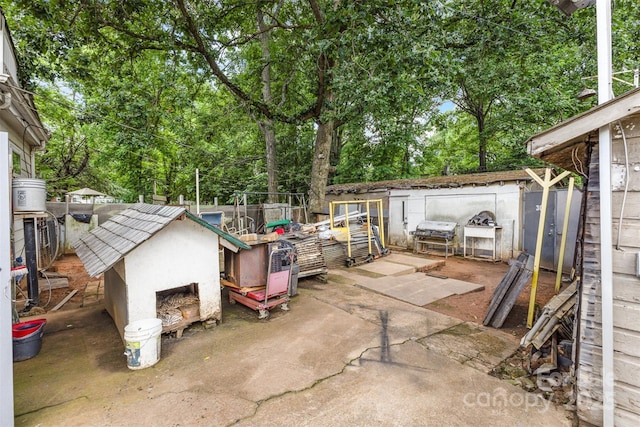 view of patio / terrace featuring a fenced backyard and view of scattered trees