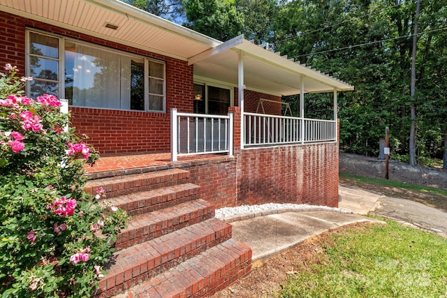 24501 Canton Rd, Albemarle, NC 28001 - property entrance featuring brick siding and covered porch