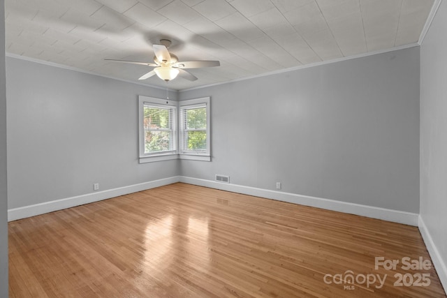 24501 Canton Rd, Albemarle, NC 28001 - spare room featuring crown molding, ceiling fan, wood finished floors, and baseboards