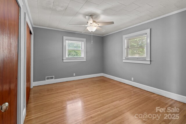 24501 Canton Rd, Albemarle, NC 28001 - unfurnished bedroom featuring ornamental molding, light wood-style floors, baseboards, a closet, and ceiling fan