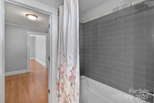 24501 Canton Rd, Albemarle, NC 28001 - bathroom featuring wood finished floors, baseboards, shower / bath combination with curtain, and ornamental molding