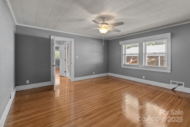 24501 Canton Rd, Albemarle, NC 28001 - empty room with ornamental molding, a ceiling fan, light wood-type flooring, and baseboards