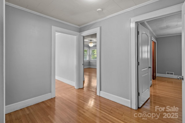 24501 Canton Rd, Albemarle, NC 28001 - spare room featuring light wood-style floors, ornamental molding, and baseboards
