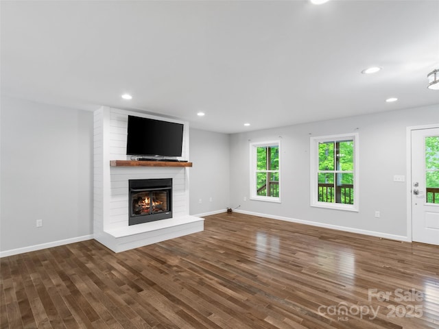 155 Pebble Ridge Rd, Spruce Pine, NC 28777 - unfurnished living room featuring a large fireplace, wood finished floors, baseboards, and recessed lighting